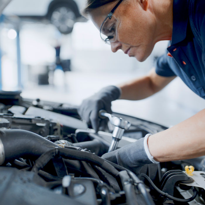 mechanic working on car