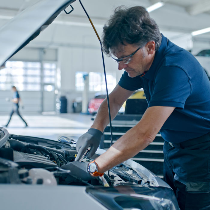 mechanic working on car
