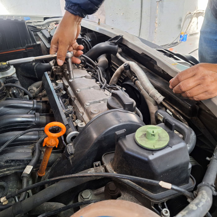 mechanic working on car